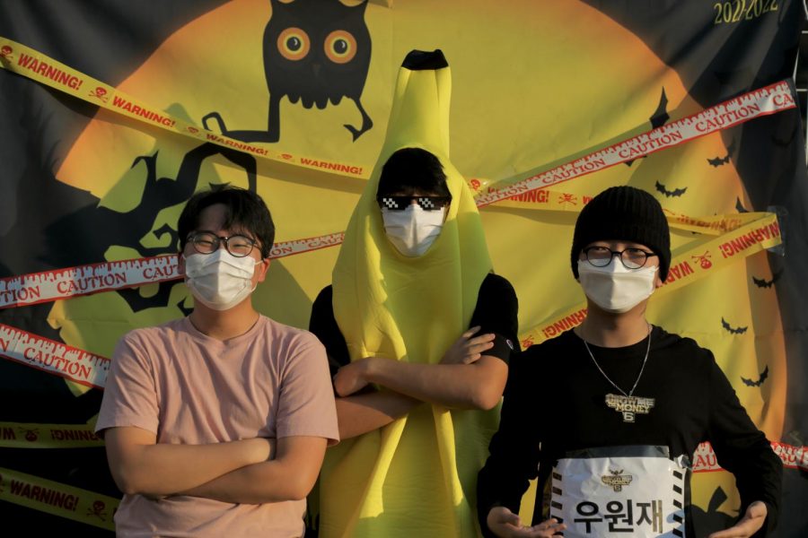 Justin Seo (12), Nicholas Baik (12), and Joseph Song (12) pose at the GIN Halloween Carnival photo booth.