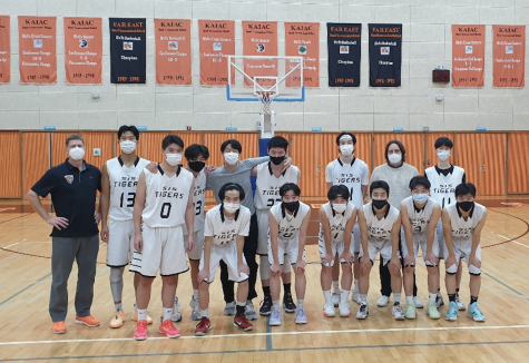 SIS varsity boys basketball team clinches its first win against YISS