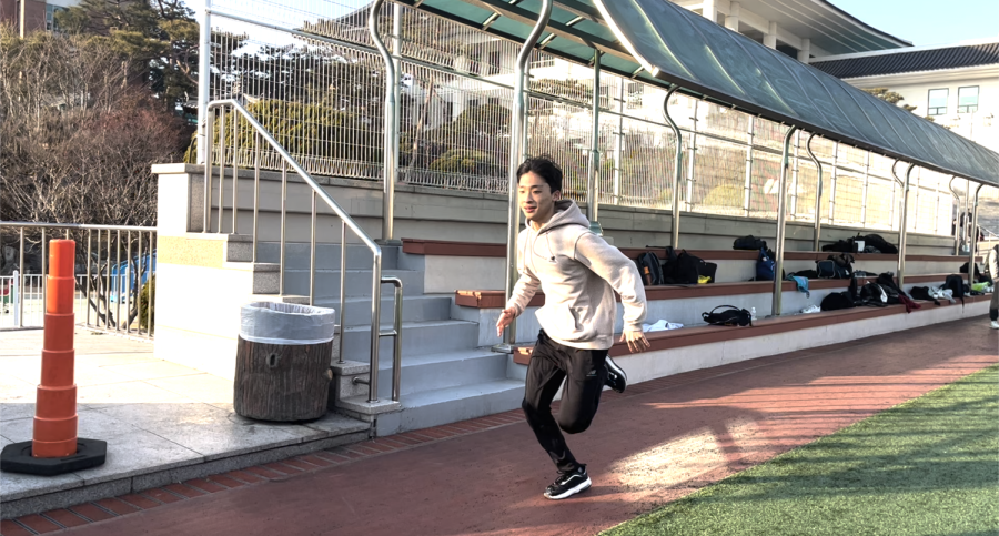 Wongyeom Yang (10) runs at track and field practice.