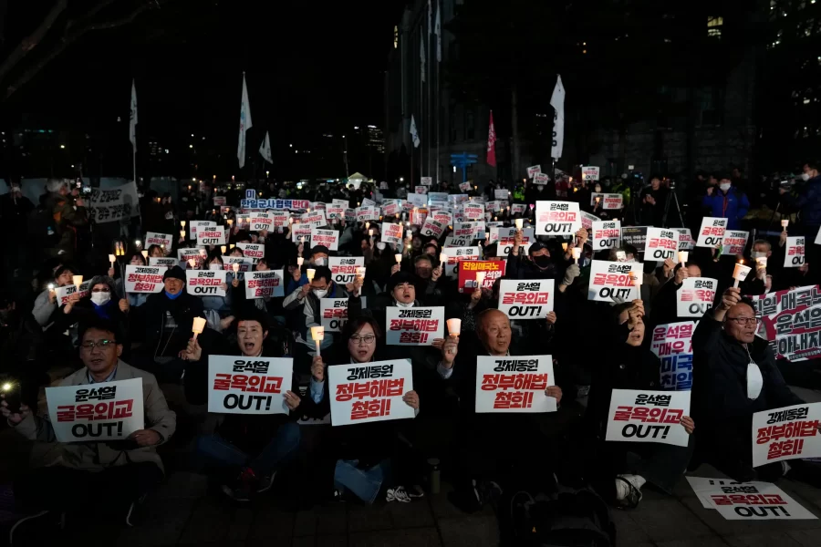 South Korean protesters denouncing the compensation plan (Source: Reuters)
