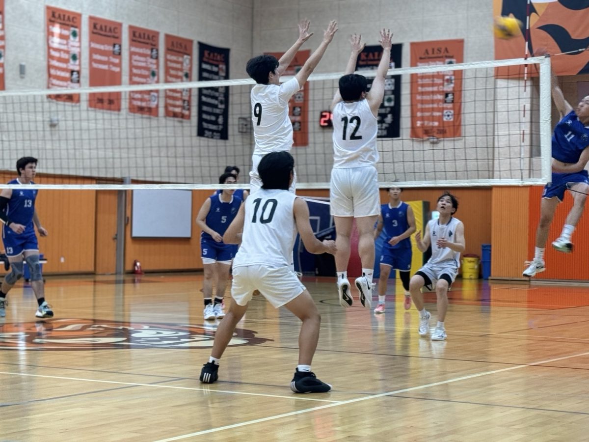 Varsity volleyball team playing against DSS
