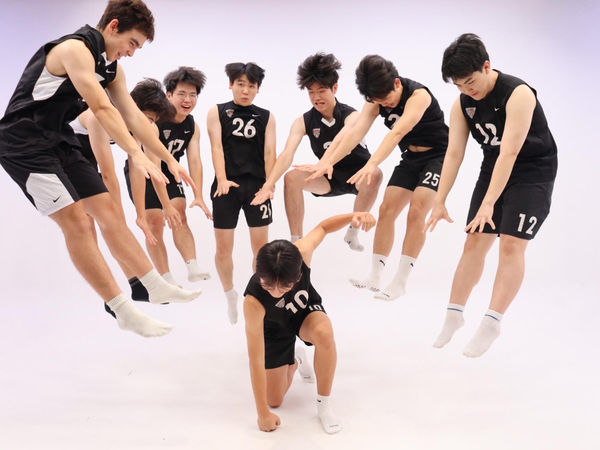 SIS varsity boys volleyball team posing during the media day.