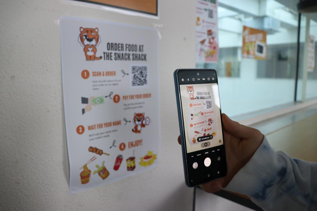 Student using QR code system to order at the snack shack
