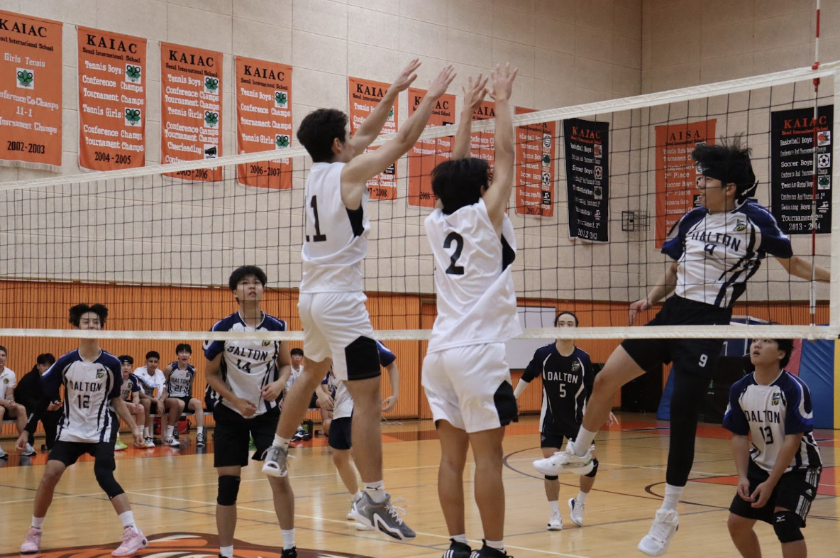 Philip Conrad Bliss (11) and Ryan Lee (11) going for a block during the CDS game
