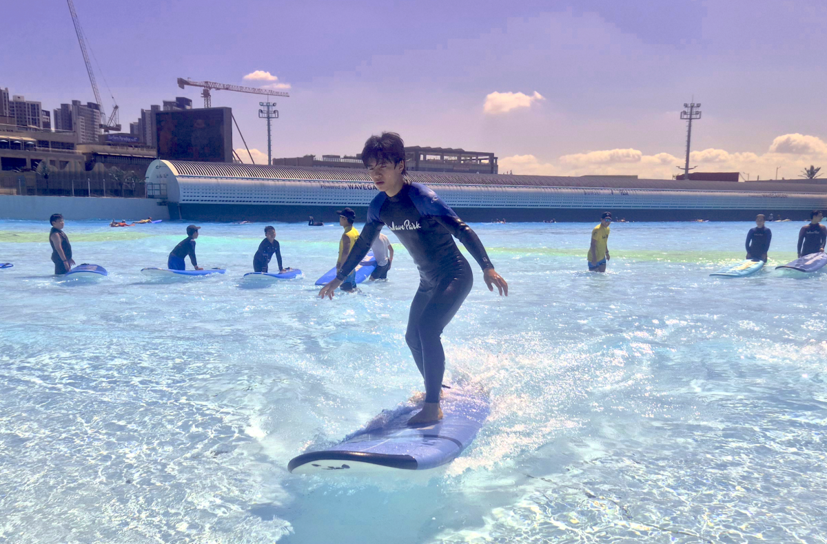 Terry Seong (12), rides the waves at Wave Park