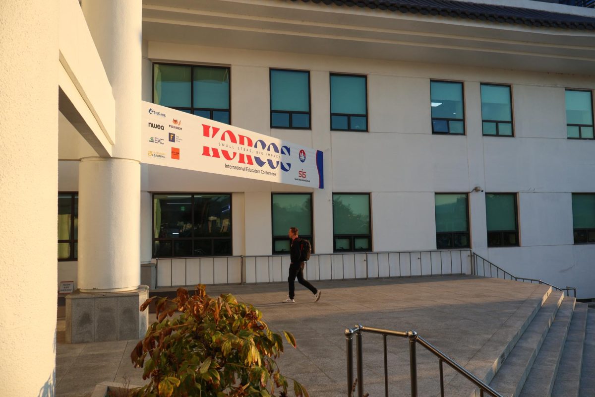 Teacher entering main building entrance