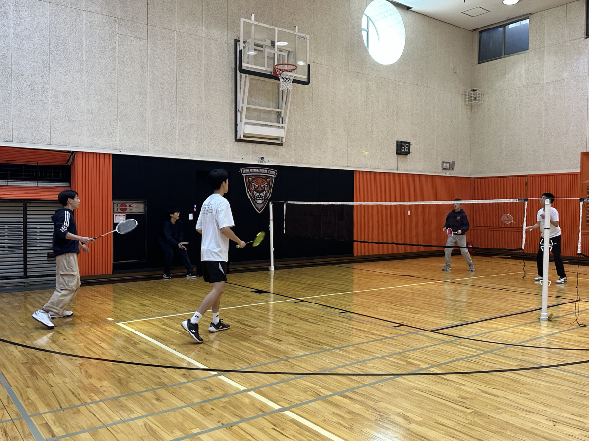 Students warm up at the badminton open gyms