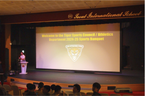 Mr.Fraseur introduces the 2024-25 sports banquet event in the auditorium

