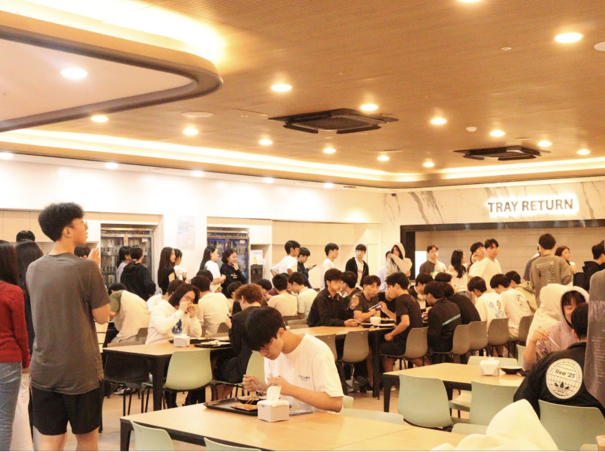 Students wait in the Korean section of the lunch line in the cafeteria 
Photo by Alex Lee
