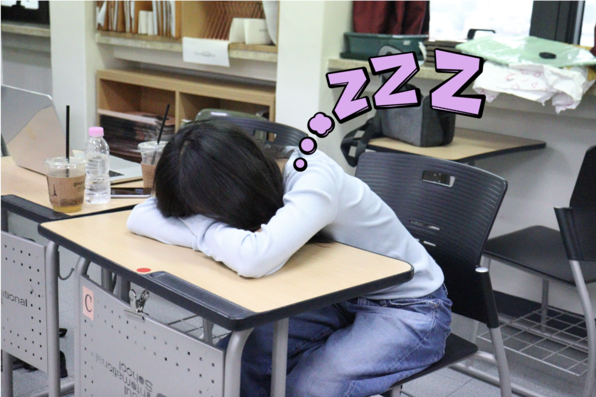Zoe Chang (11) takes a nap during class