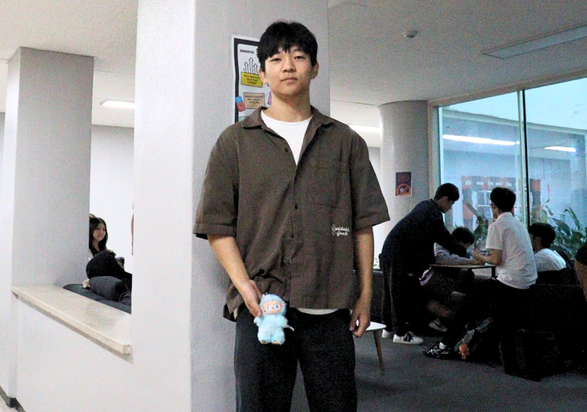 Justin Hong (12) holding his Labubu prize