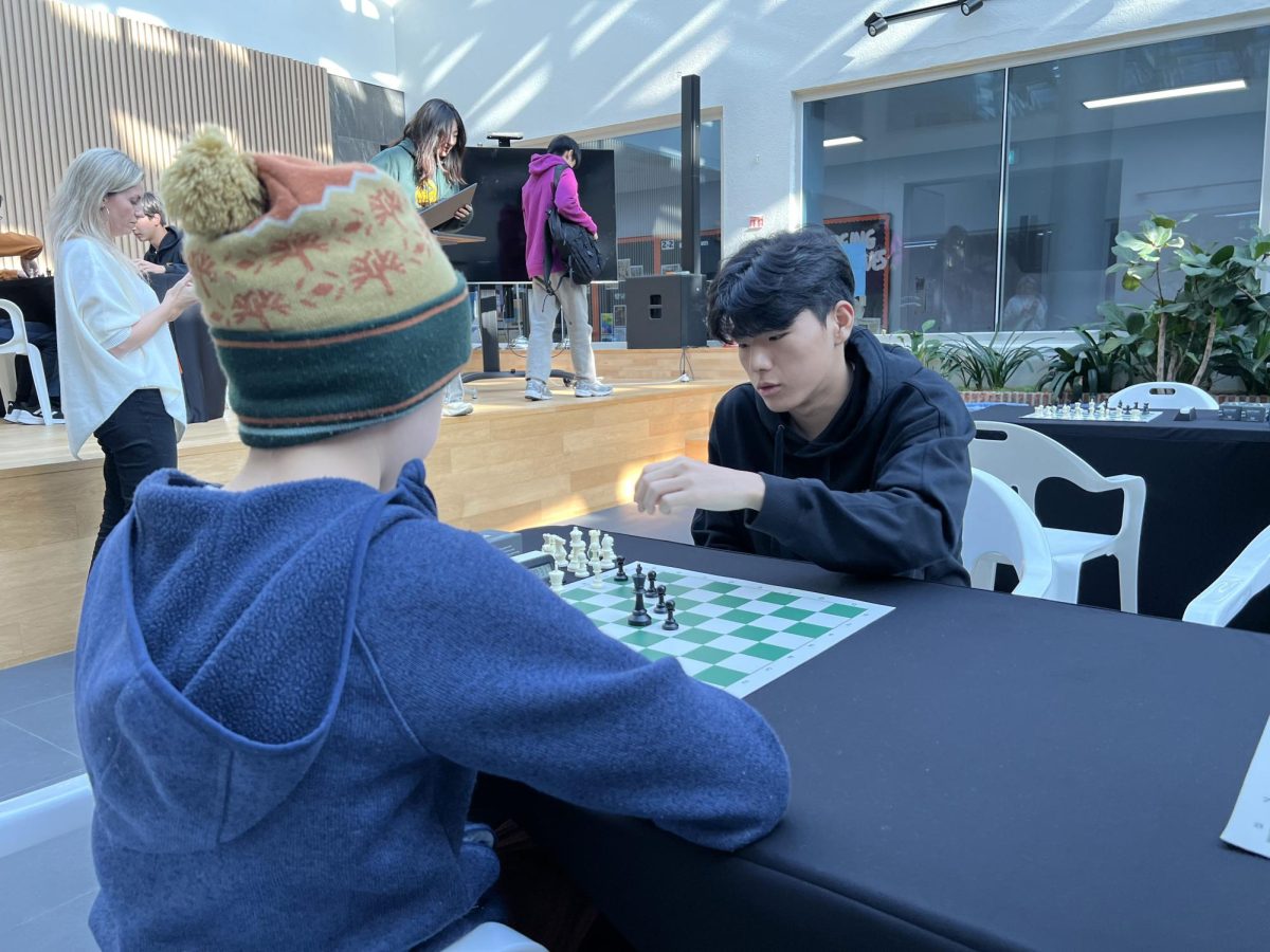 Donghoon Lee (11), competes against a student in the tournament