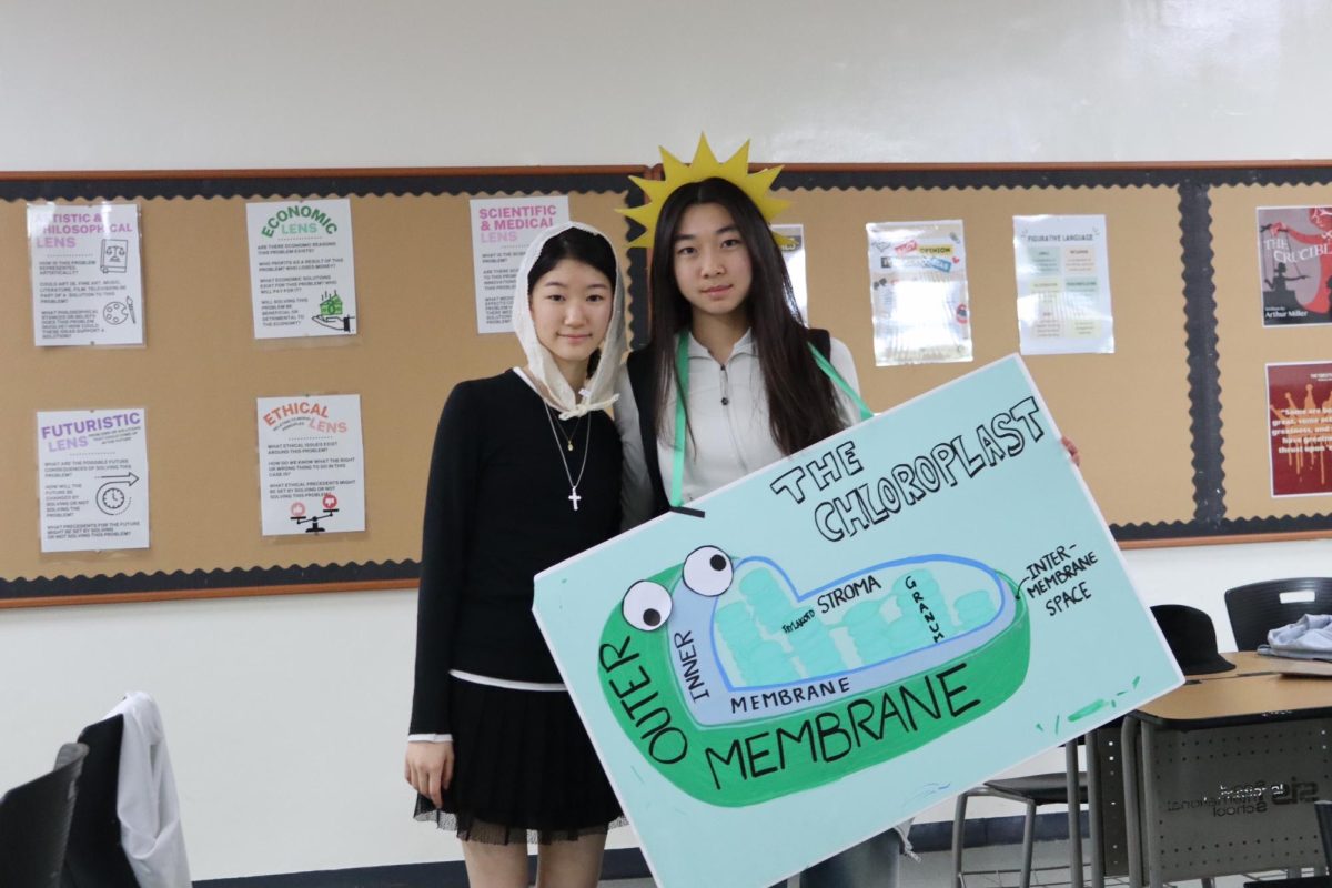 Regina Kim (10) dresses up as Abigail from The Crucible, and Chloe Kim (10) dresses up as a chloroplast.
