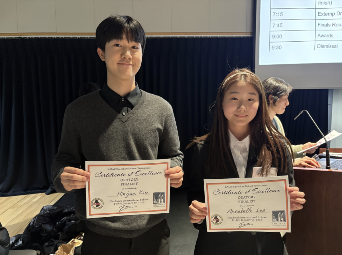 Oratory Speech Finalists Minjun Kim (10) (left) and Annabelle Lee (9) (right) pose for a photo.