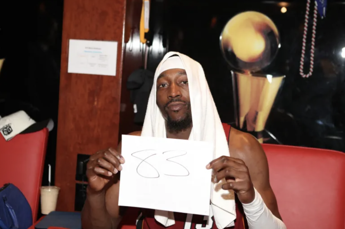 Bam Adebayo holds up a paper with his record-breaking ‘83’ points marked on it, forever engraving his name into NBA history.
