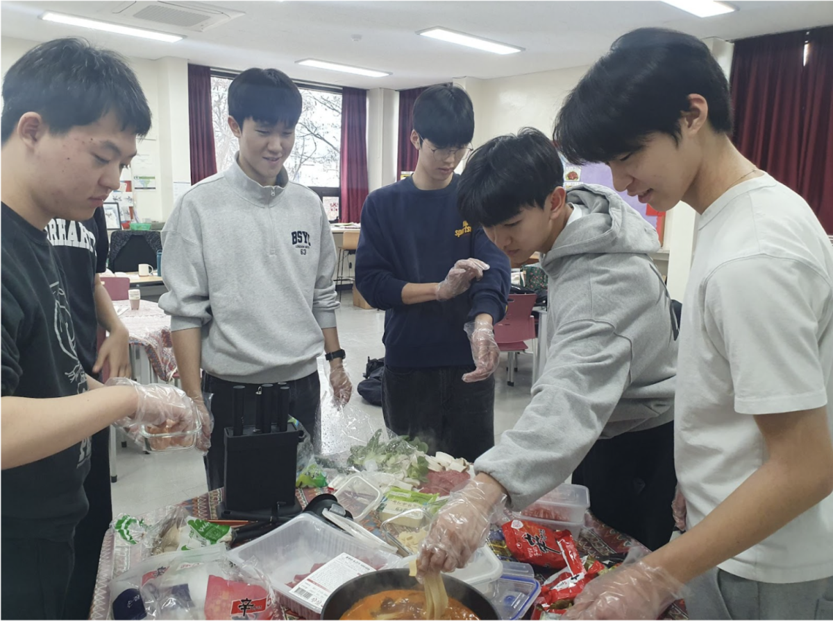 Chinese 3 students work together to prepare the hot pot dish for the lunar holiday 

