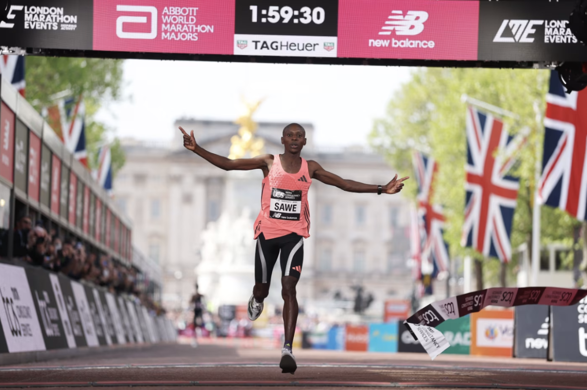 Sawe crosses the finish line of the London Marathon


