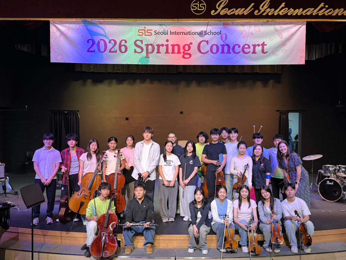 Tri-M Music Honor Society members gather after the concert